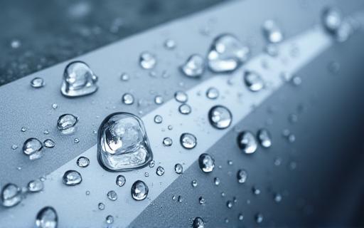 Water beading off a car with a ceramic coating.